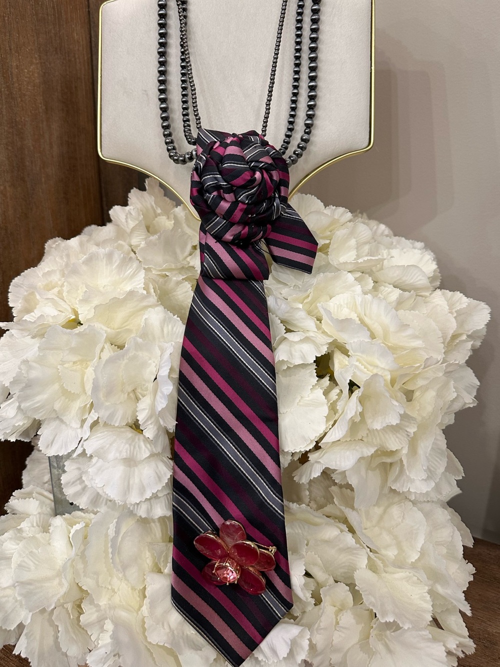 Striped Pink and Black Necktie Necklace with Floral Accent